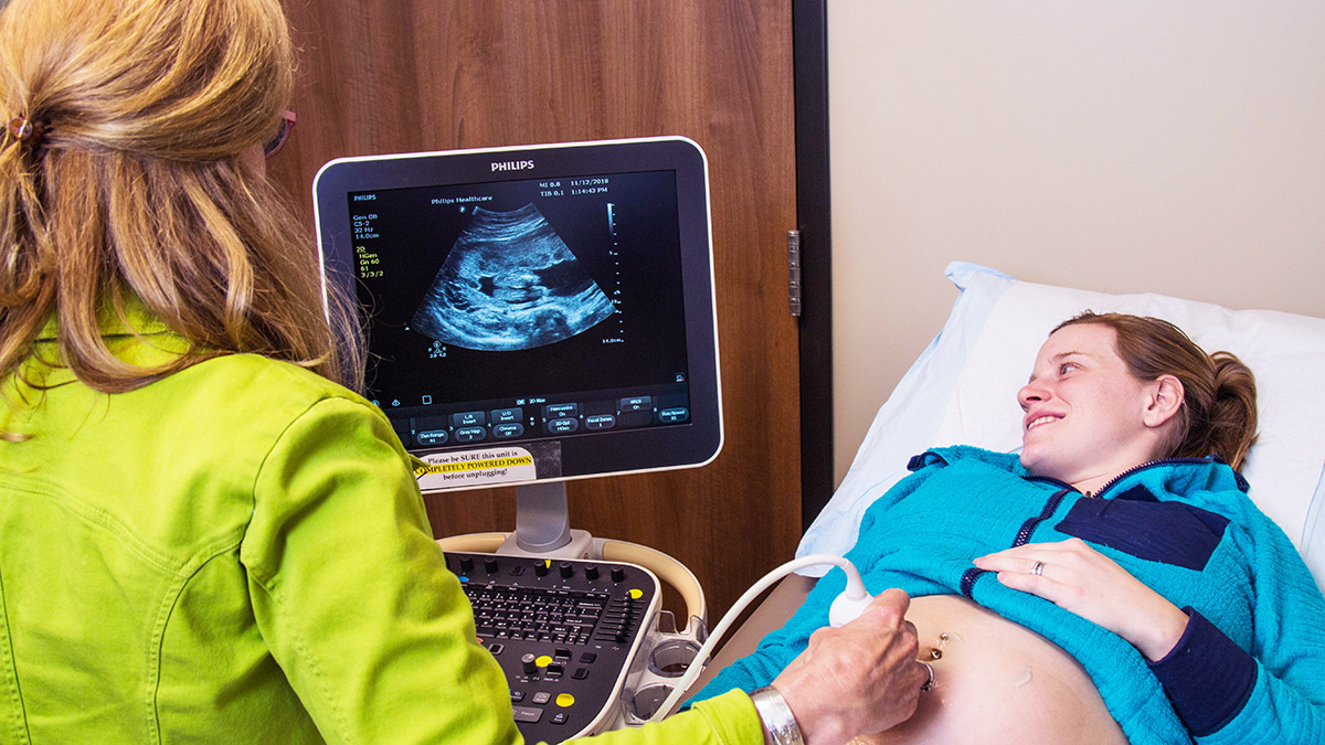 woman receiving sonogram