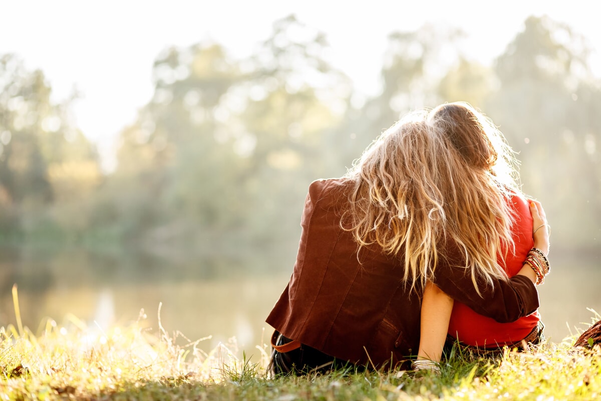 woman supporting child